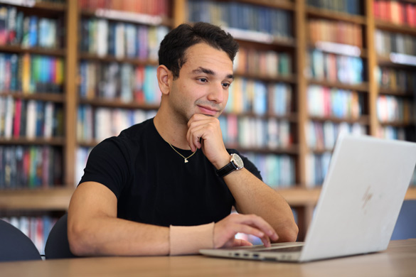 Student working on laptop in the SOTA library